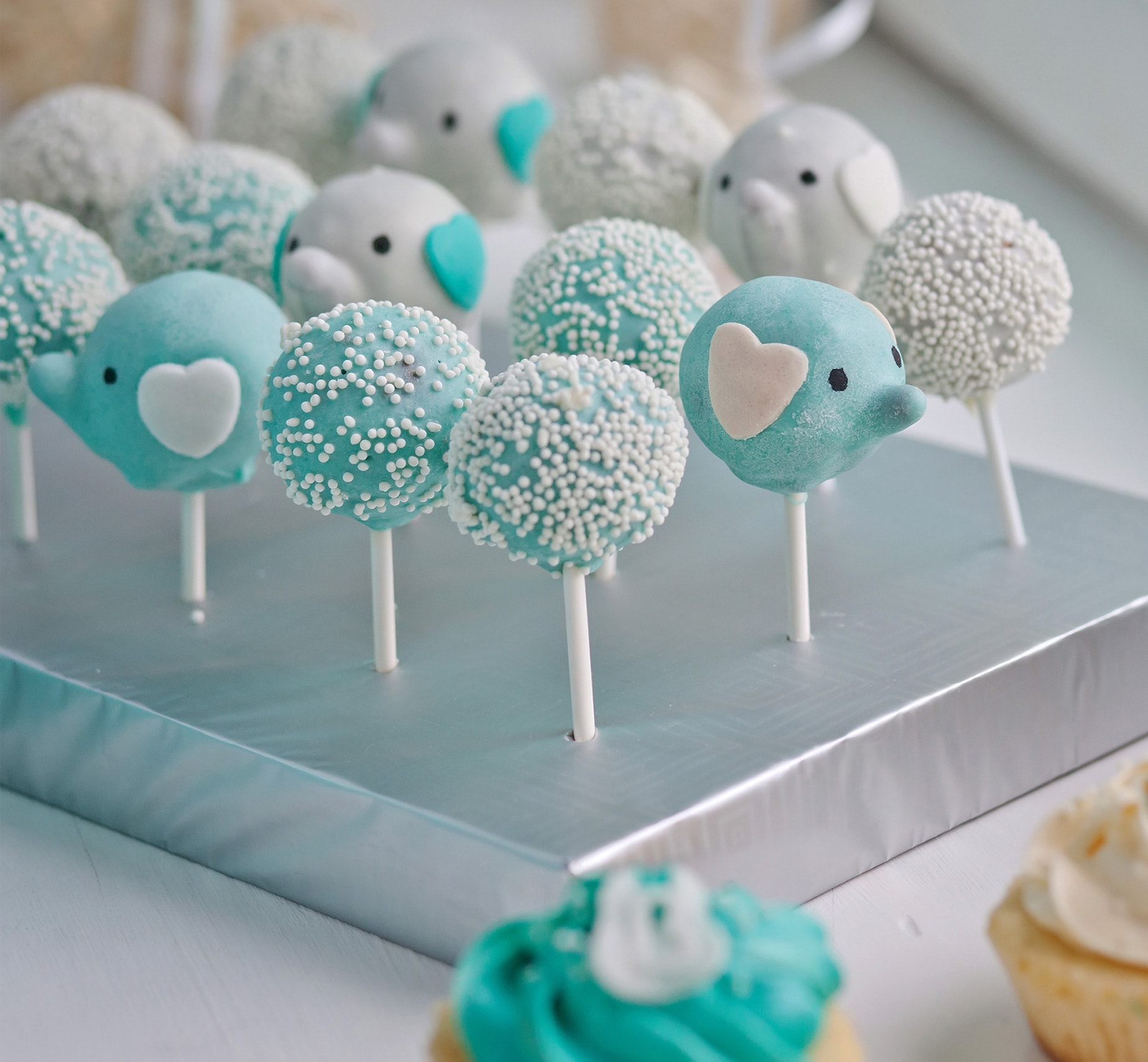 Adorable blue baby shower custom cake pops